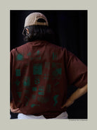 USAGE JZ Festival Graphic Cotton T Shirt in Brown - On Model