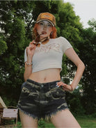 BeerBro Distressed Raw Hem Denim Shorts in Denim - On Female Model