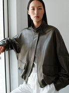 MSBEAST Oil Waxed Sheepskin Stand Collar Jacket in Olive - On Female Model
