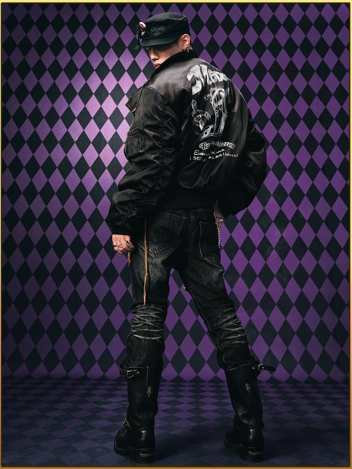 MEDM JoJo Collab Graphic Puffer Bomber in Black - On Male Model