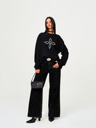 SMFK Cross Print Cotton Sweatshirt in Black - On Female Model