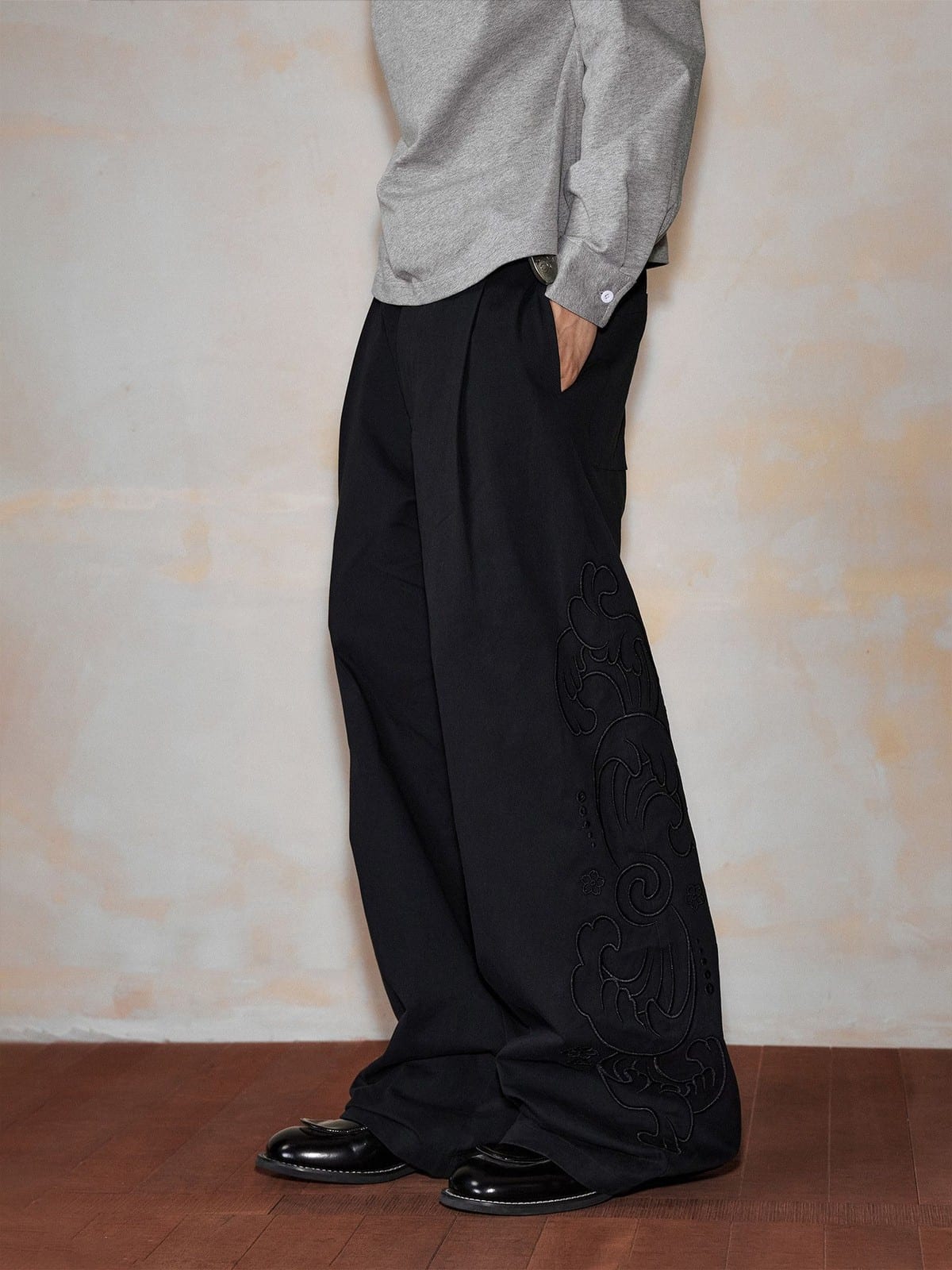 MEDM Embroidered Cotton Cargo Pants in Black - On Model