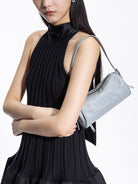 Grotto Pleated Leather Cylinder Bag in Sky Blue - On Female Model
