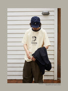USAGE Graphic Cotton Ringer T Shirt in Cream - On Male Model