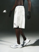 LOSTCTRL Distressed Structural Print Shorts in White - On Male Model