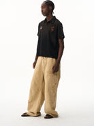 BLINDNOPLAN Distressed Embroidered Cotton Polo in Black - On Male Model