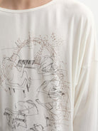 JCAESAR STUDIO Piano Print Tencel Wool Long Sleeve Top in White - On Model