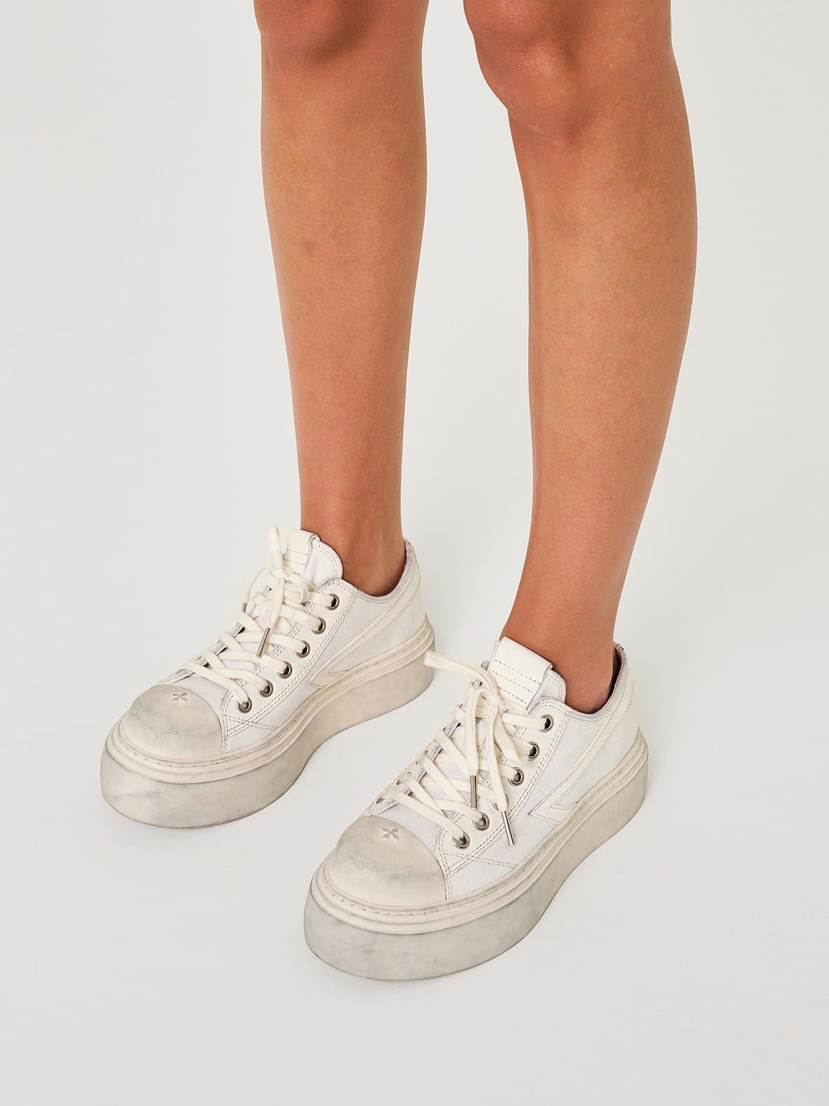 SMFK Distressed Canvas Skate Sneakers in White - On Female Model