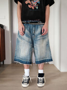 UNKNOWNWORLD Distressed Wash Baggy Shorts in Blue - On Male Model