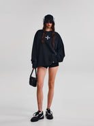 SMFK Oversized Cotton Long Sleeve Sweatshirt in Black - On Female Model