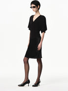 RARELY ALIKE Lyocell V Neck Batwing Sleeve Top in Black - On Female Model