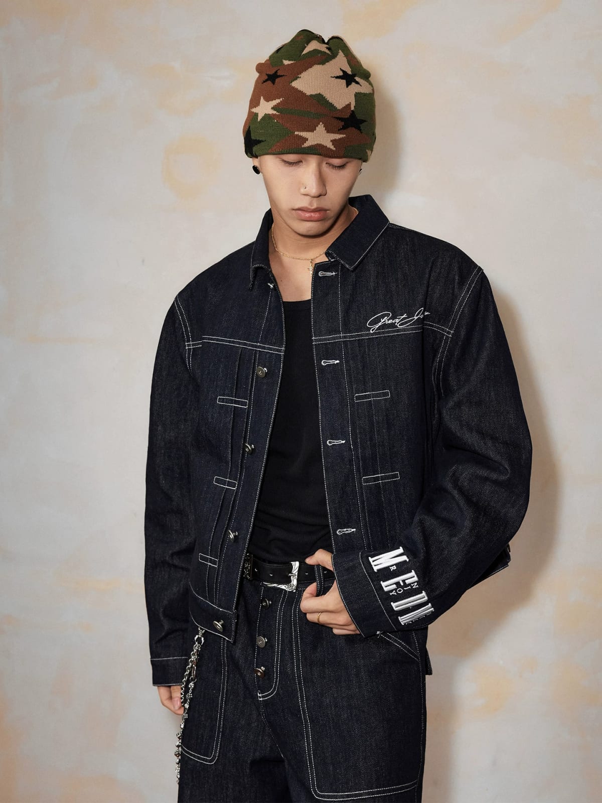 MEDM Embroidered Cuff Raw Denim Jacket in Blue - On Male Model