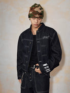 MEDM Embroidered Cuff Raw Denim Jacket in Blue - On Male Model