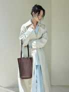 QIUZHEN Vegetable Tanned Leather Bucket Bag in Brown - On Female Model