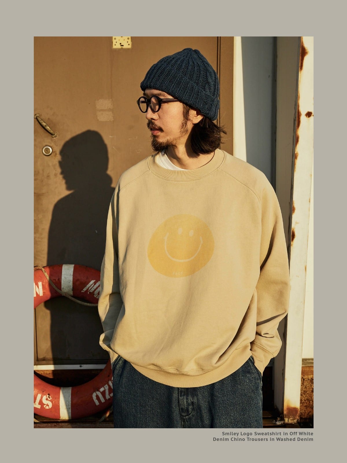 USAGE Washed Cotton Raglan Smiley Sweatshirt in Beige - On Male Model