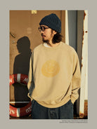 USAGE Washed Cotton Raglan Smiley Sweatshirt in Beige - On Male Model