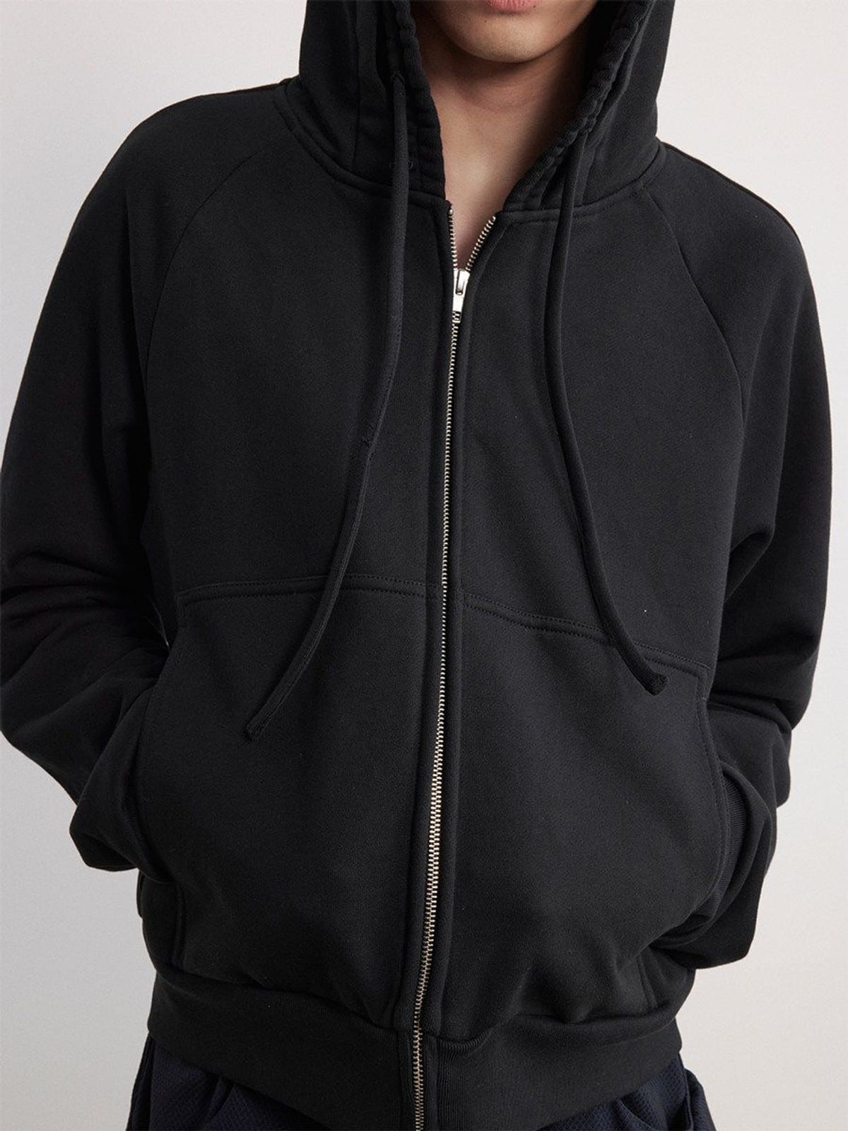 JCAESAR STUDIO Cotton Raglan Zip Up Hoodie in Black - On Model
