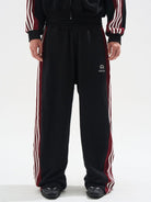 BLINDNOPLAN Raw Edge Contrast Paneled Sweatpants in Black - On Male Model