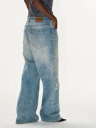 BLINDNOPLAN Paneled Embroidered Distressed Denim Pants in Blue - On Model
