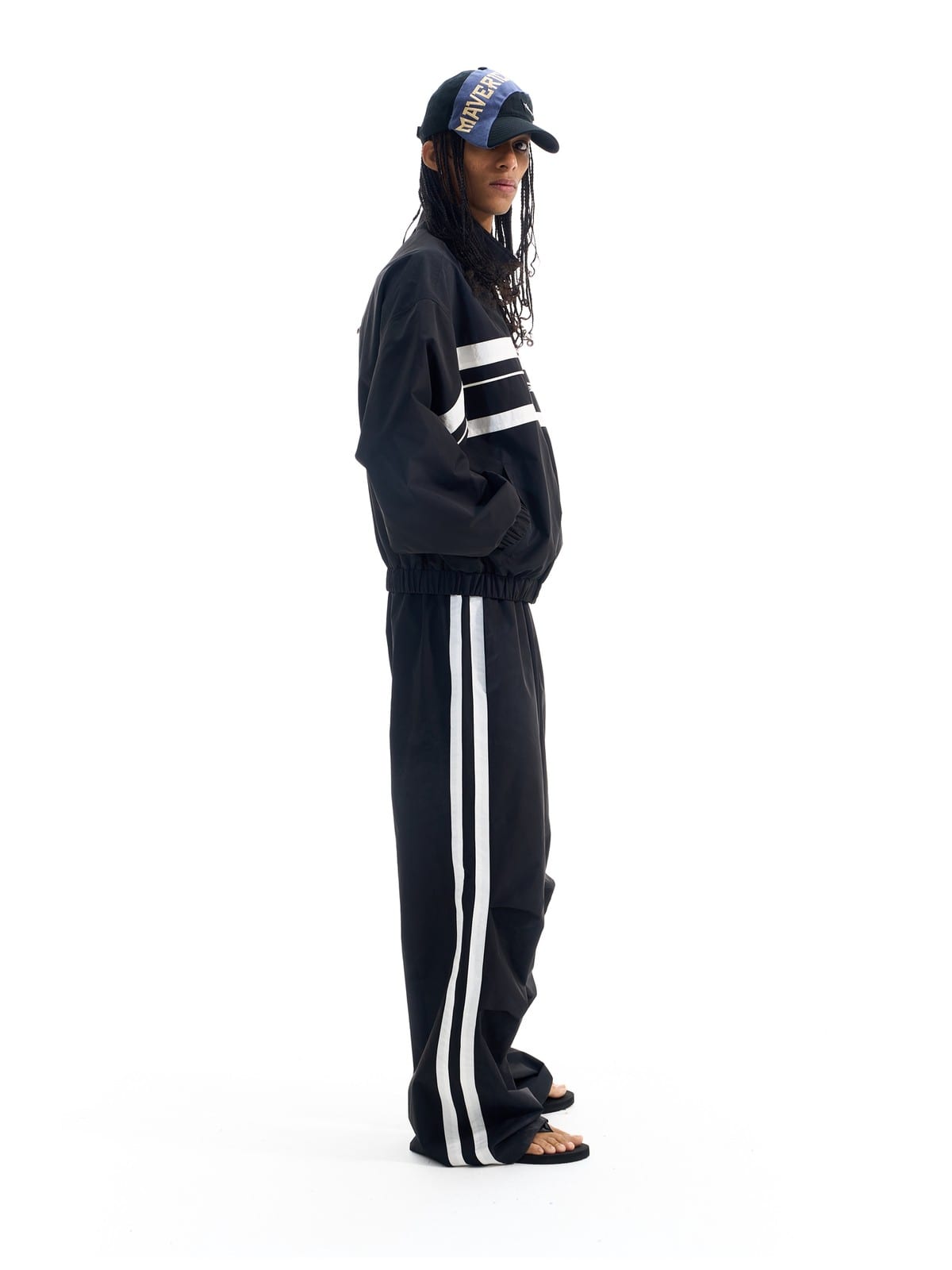 BLINDNOPLAN Striped Pleated Track Pants in Black - On Model