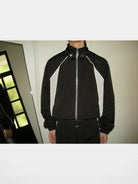 AFterTaste Oversized Zip Up Track Jacket in Black - On Male Model