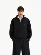 MASONPRINCE Stand Collar Windbreaker Pants Set in Black - On Male Model