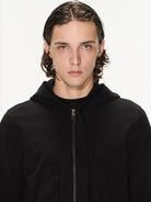 BLINDNOPLAN Cropped Zip Up Hoodie with Structured Trim in Black - On Male Model