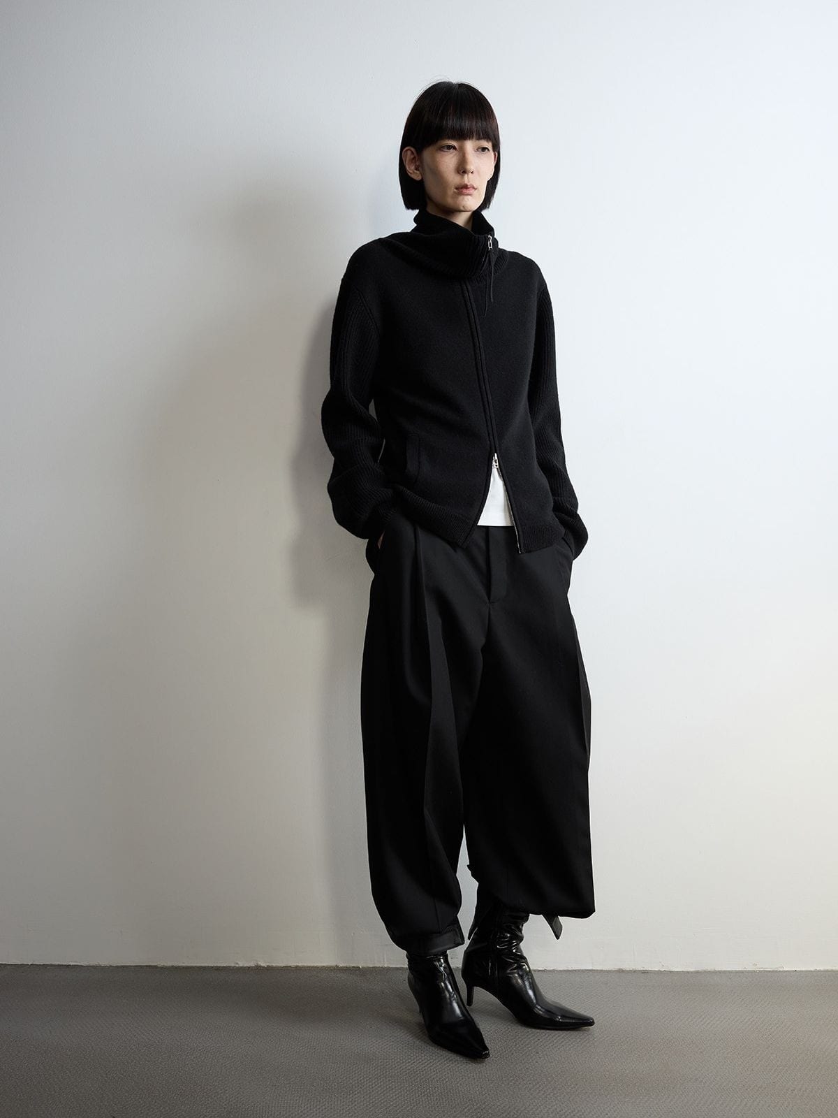 Random Piece Pleated Merino Wool Wide Leg Trousers in Black - On Female Model