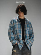 LOSTCTRL Frayed Asymmetric Plaid Shirt in Blue - On Male Model