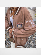 BeerBro Route 96 Retro Varsity Jacket in Coffee - On Female Model