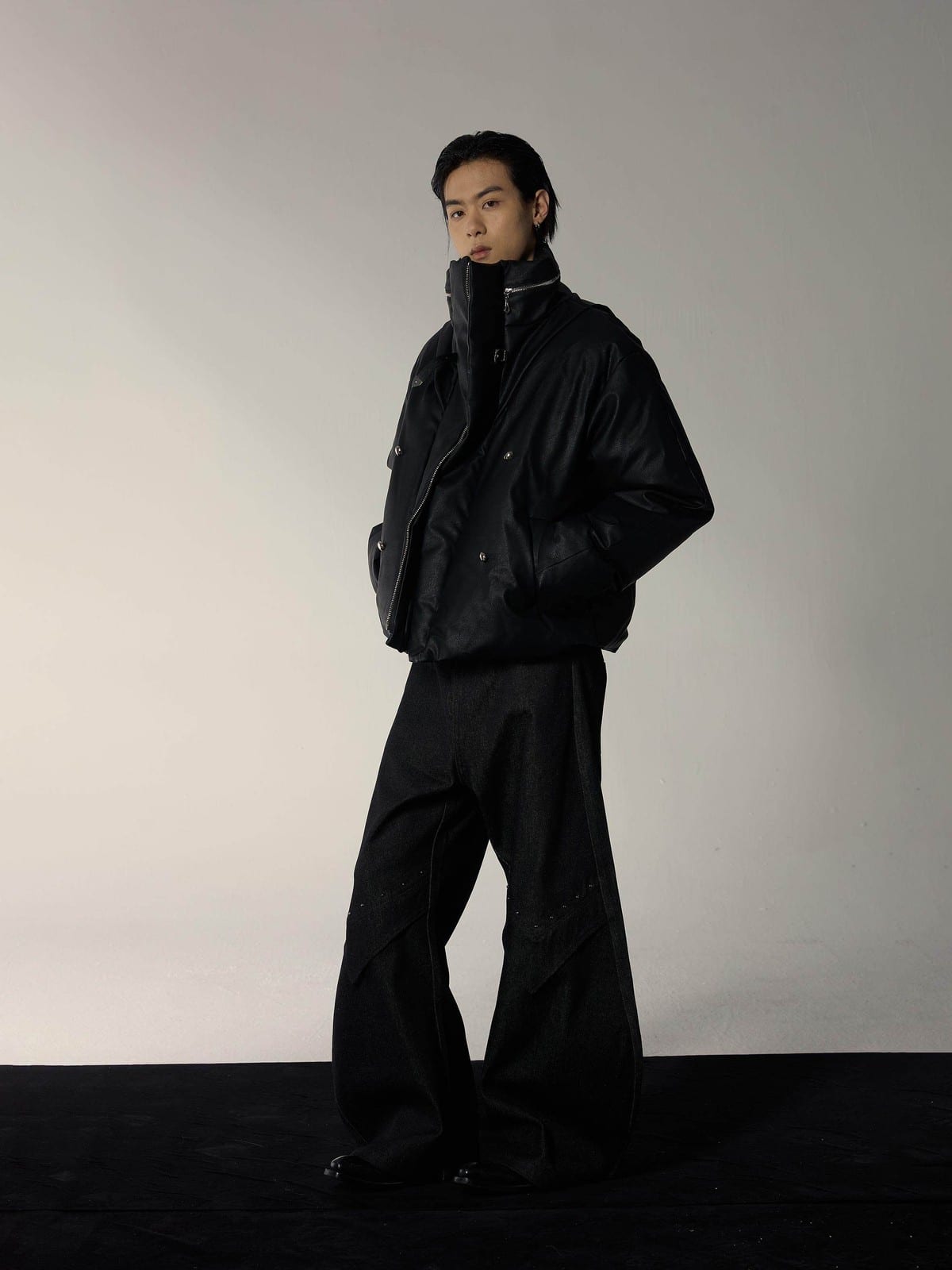 Y OFFICIAL Cropped Faux Leather Down Puffer in Black - On Male Model