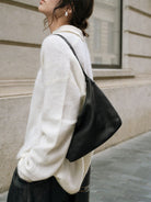 QIUZHEN Vegetable Tanned Calfskin Hobo Bag in Black - On Female Model