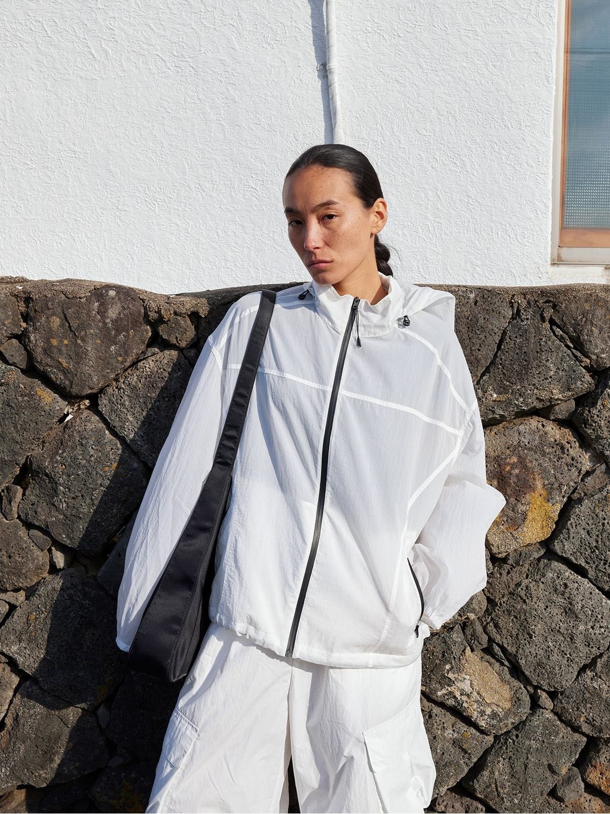 Random Piece Lightweight Cropped Hooded Nylon Jacket in White - On Female Model