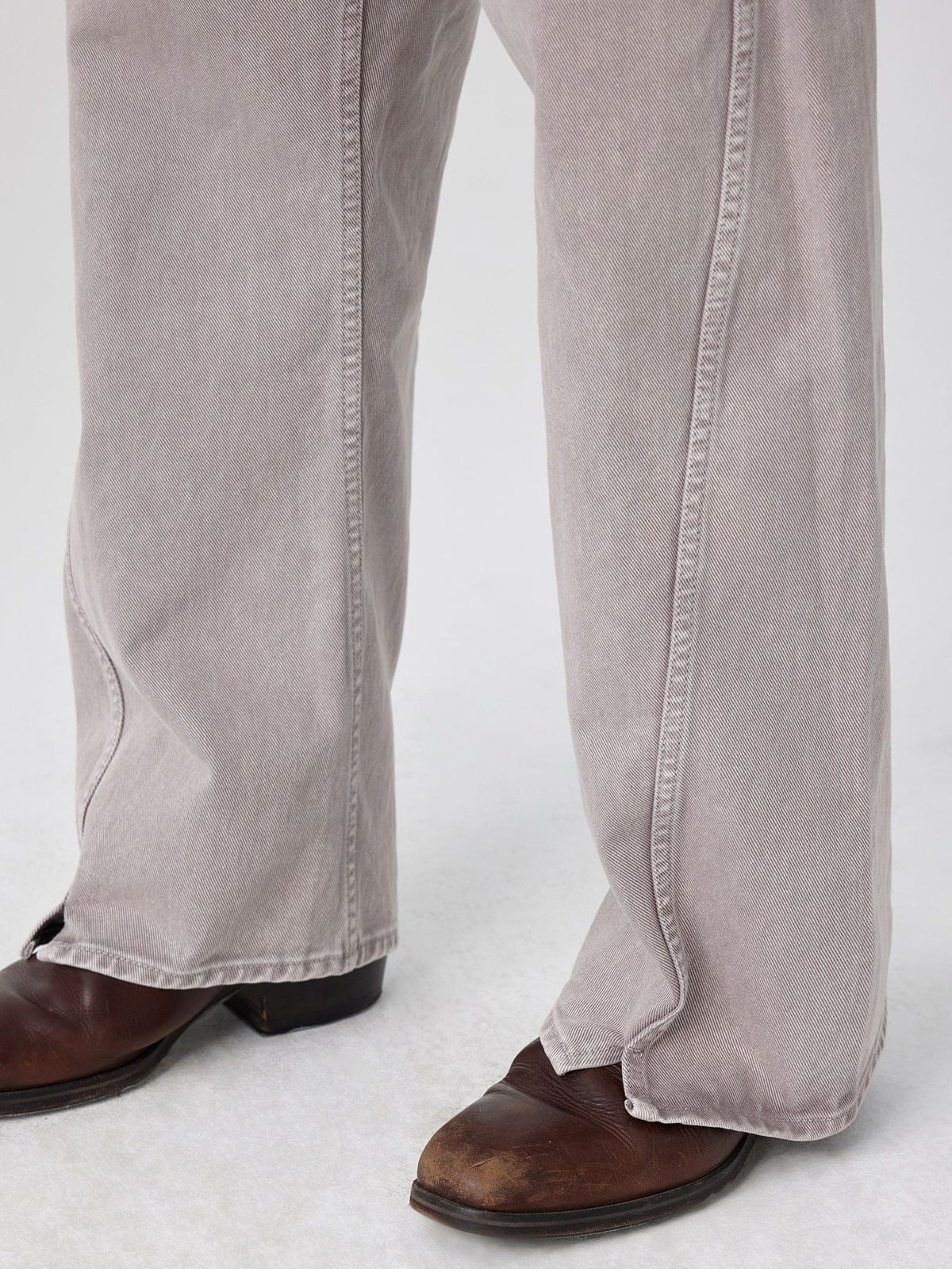 SIMPLE PROJECT Belted Garment Dyed Curved Jeans in Purple - On Model