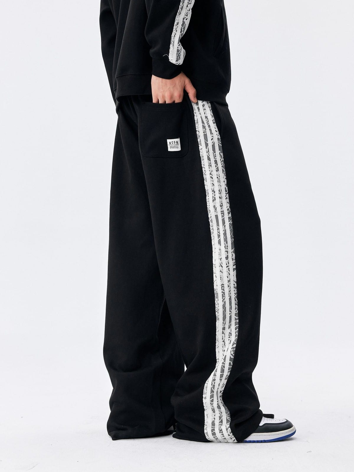 MEDM Lace Paneled Striped Track Pants in Black - On Model