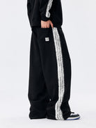 MEDM Lace Paneled Striped Track Pants in Black - On Model