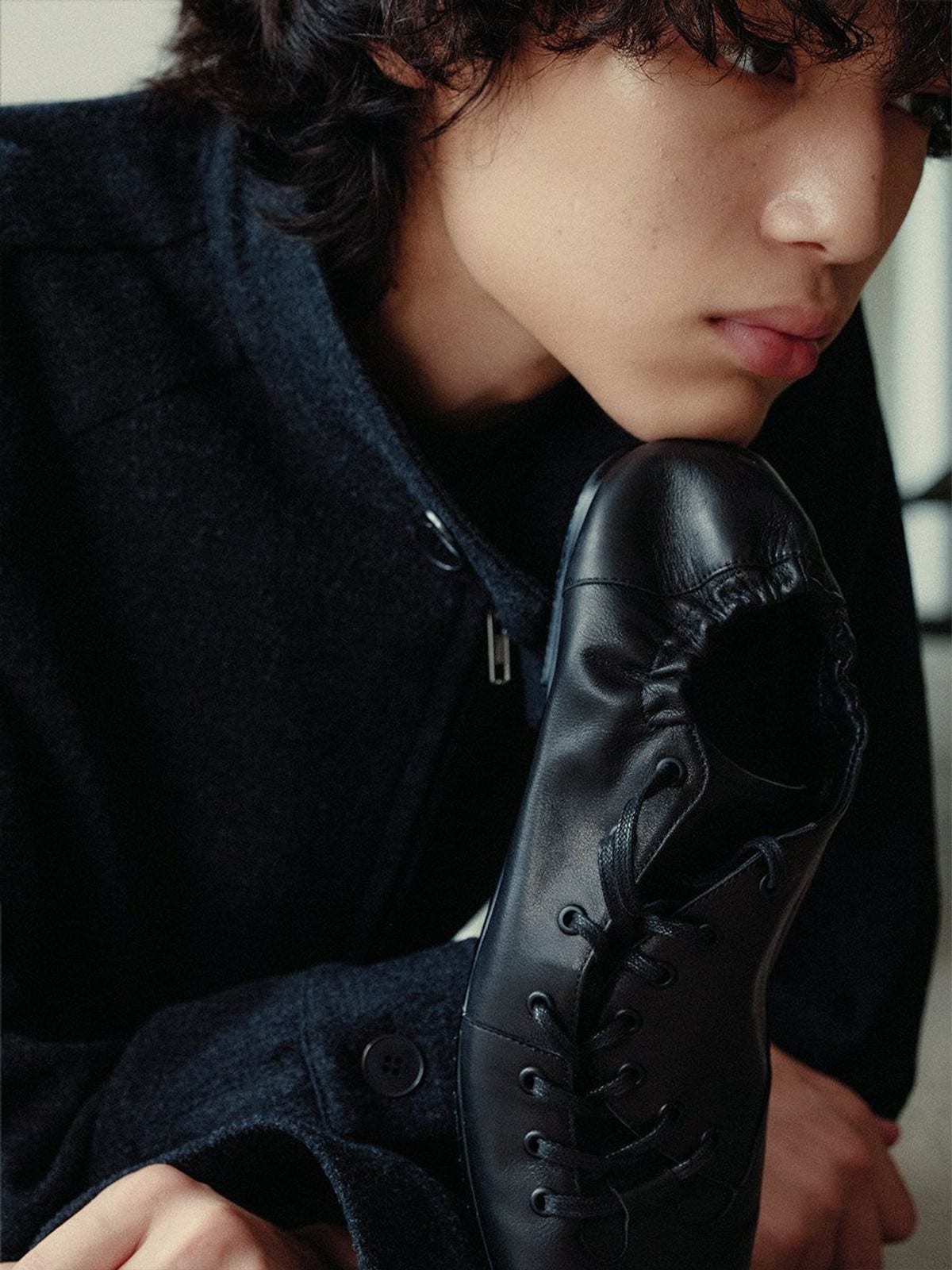 JCAESAR STUDIO Ruched Asymmetrical Leather Sneakers in Black - On Male Model