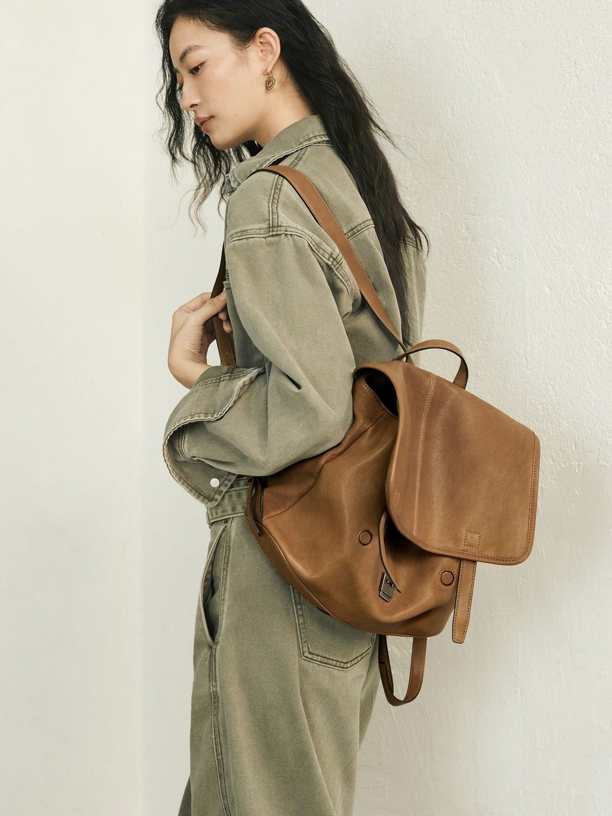 QIUZHEN Vegetable Tanned Goatskin Messenger Backpack in Brown - On Female Model