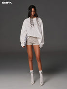 SMFK Stretch Cotton Denim Shorts in Beige - On Female Model