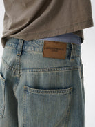 MASONPRINCE Frayed Hem Slub Denim Pants in Light Blue - On Model