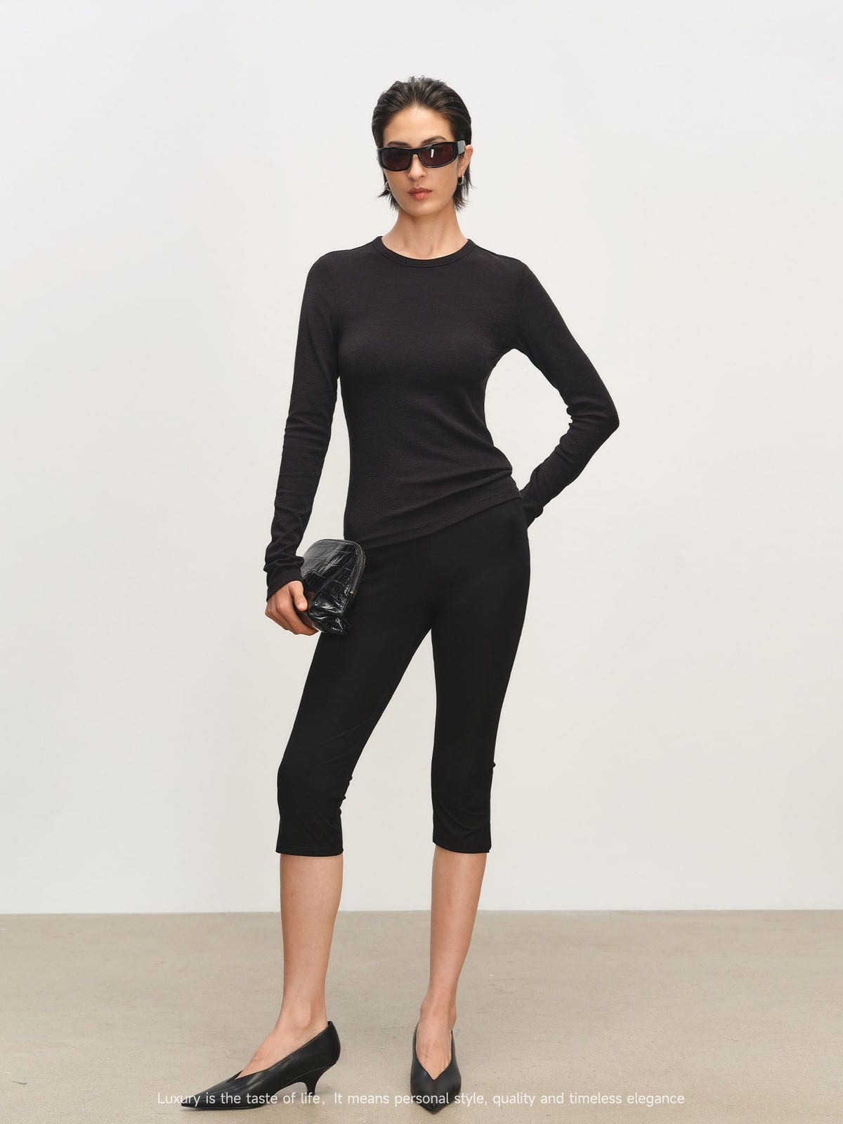 MSBEAST Viscose Blend Capri Leggings in Black - On Female Model