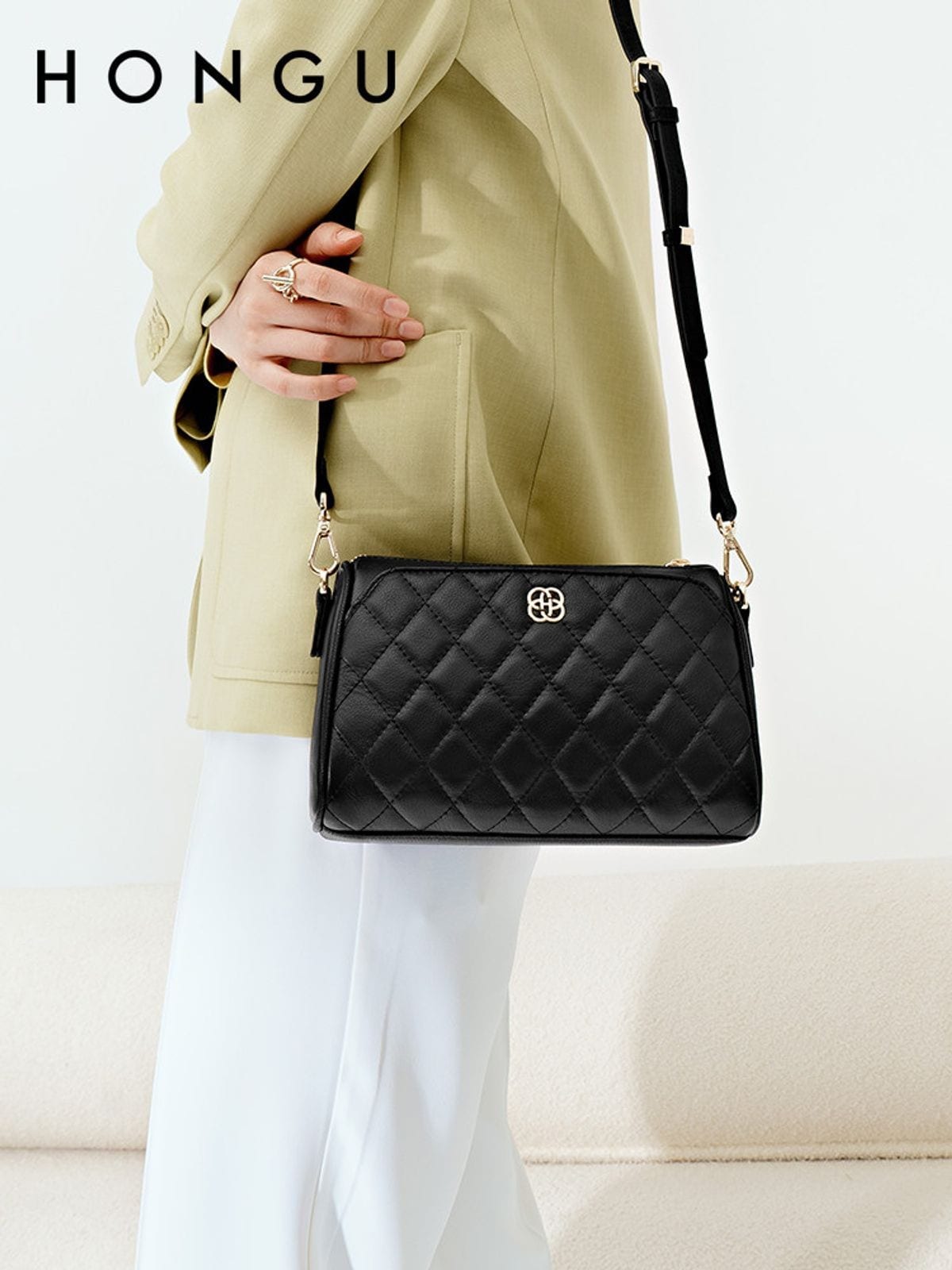 HONGU Quilted Leather Chain Crossbody Bag in Black - On Female Model