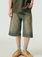 SIMPLE PROJECT Distressed Heavy Wash Denim Shorts in Blue - On Male Model