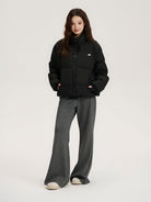 LOSTCTRL 90 White Duck Down Puffer Jacket in Black - On Female Model