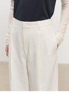 MSBEAST Cotton Blend Tapered Cropped Trousers in White - On Female Model