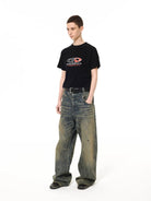 UNKNOWNWORLD Mud Dyed Distressed Baggy Jeans in Yellow - On Female Model