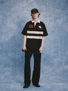 SOD Distressed Embroidered Rugby Polo in Black - On Male Model