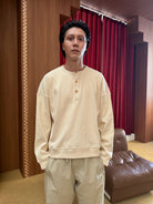 TRIANGLE PROJECT Ribbed Cotton Henley Sweatshirt in White - On Male Model