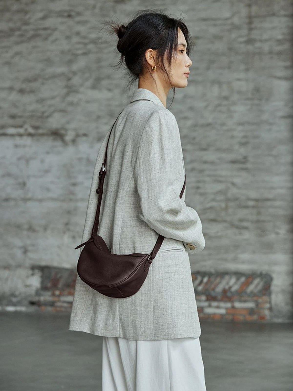 QIUZHEN Vegetable Tanned Leather Crescent Bag in Brown - On Female Model