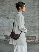 QIUZHEN Vegetable Tanned Leather Crescent Bag in Brown - On Female Model